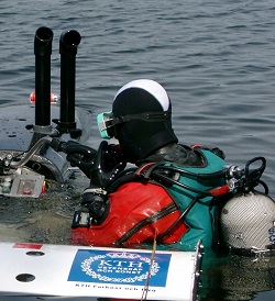 Diver outdoors with a robot.